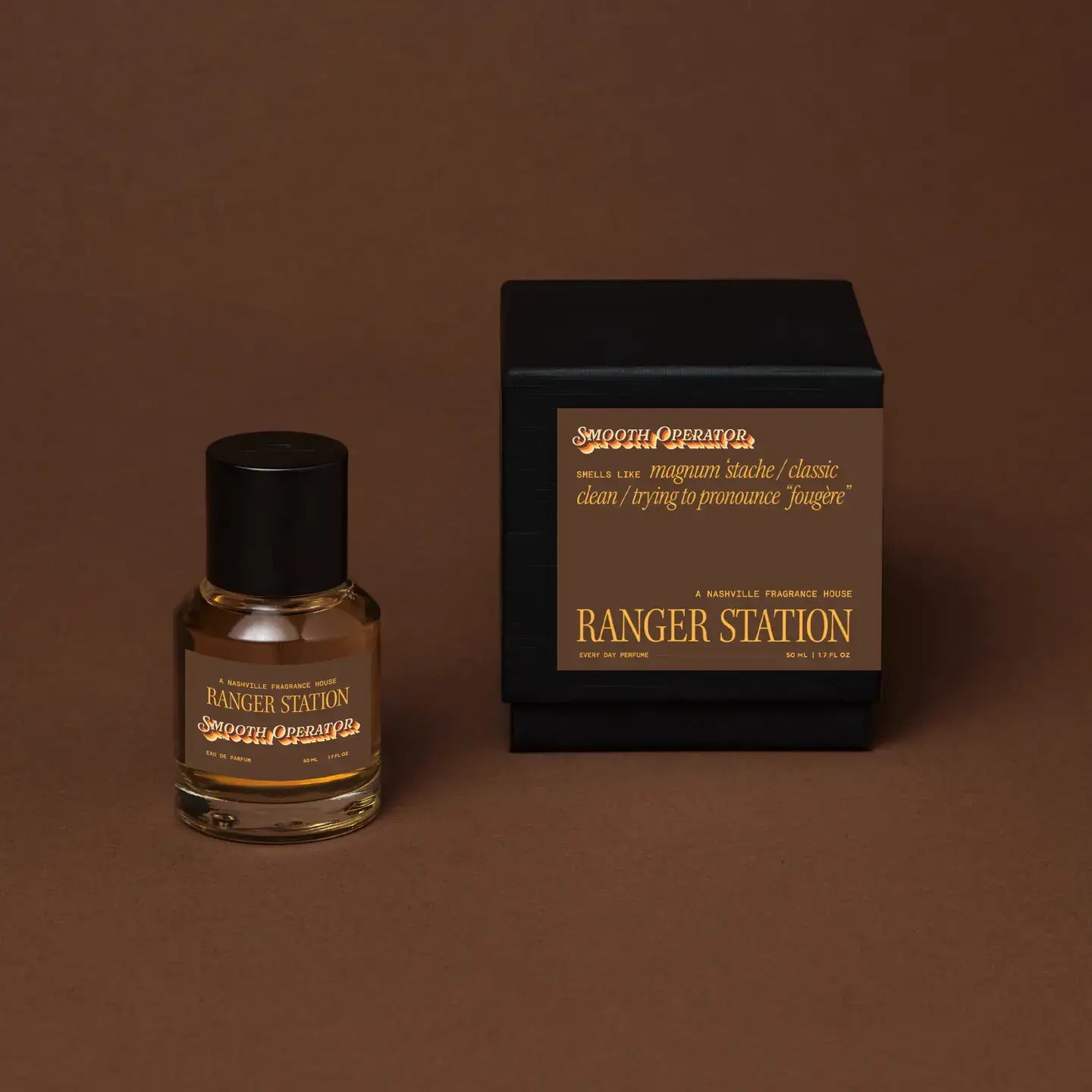 Perfume bottle and packaging of 'Ranger Station' on a brown background