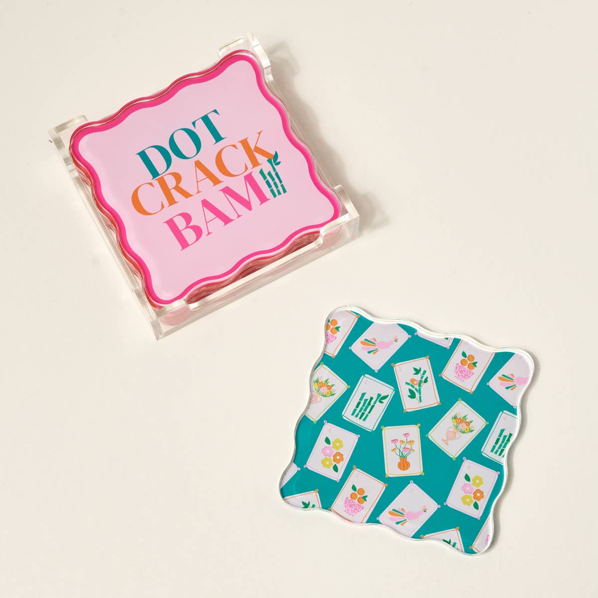Packaged game with colorful text and a decorative card on a beige background