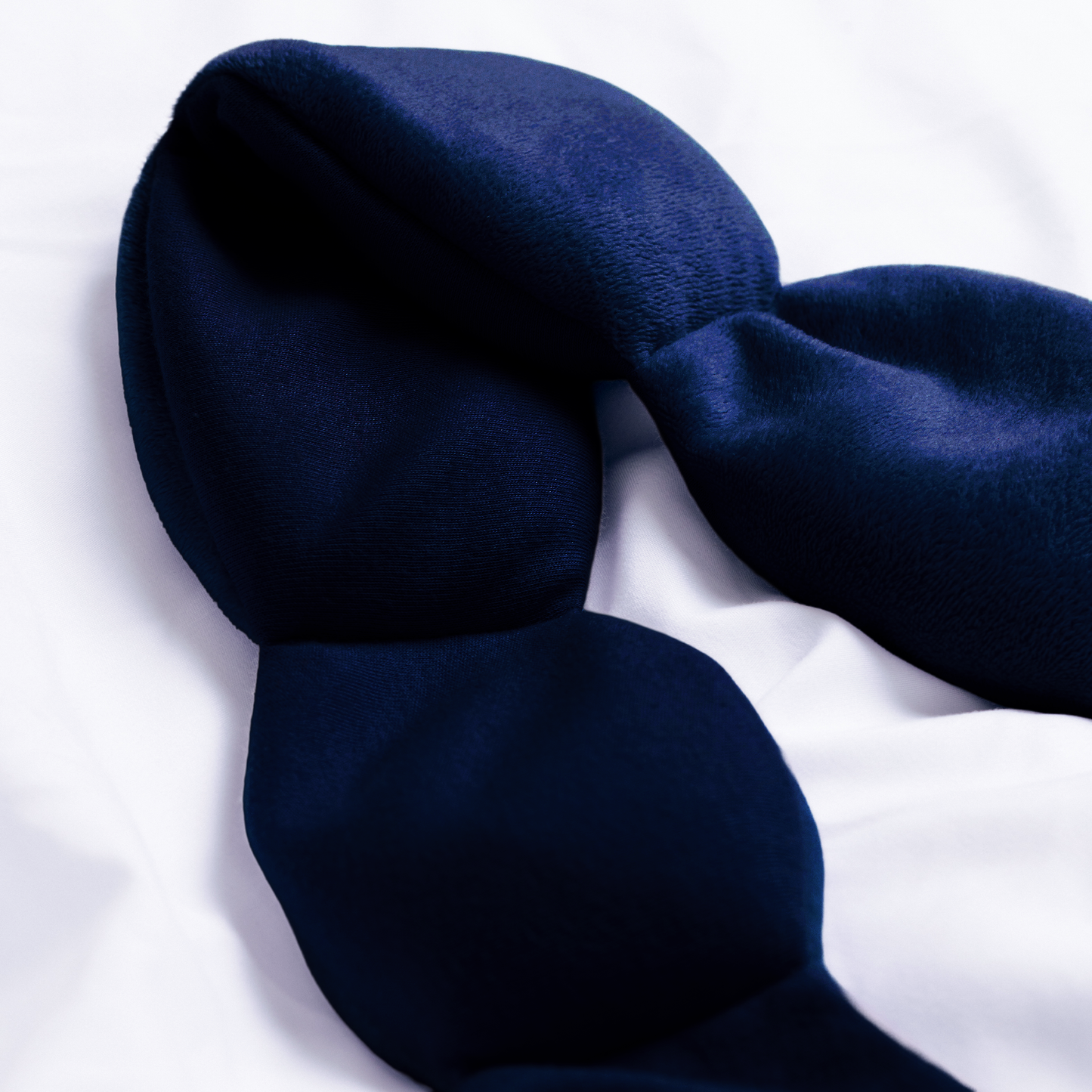 Navy blue Nod Pod on a white background