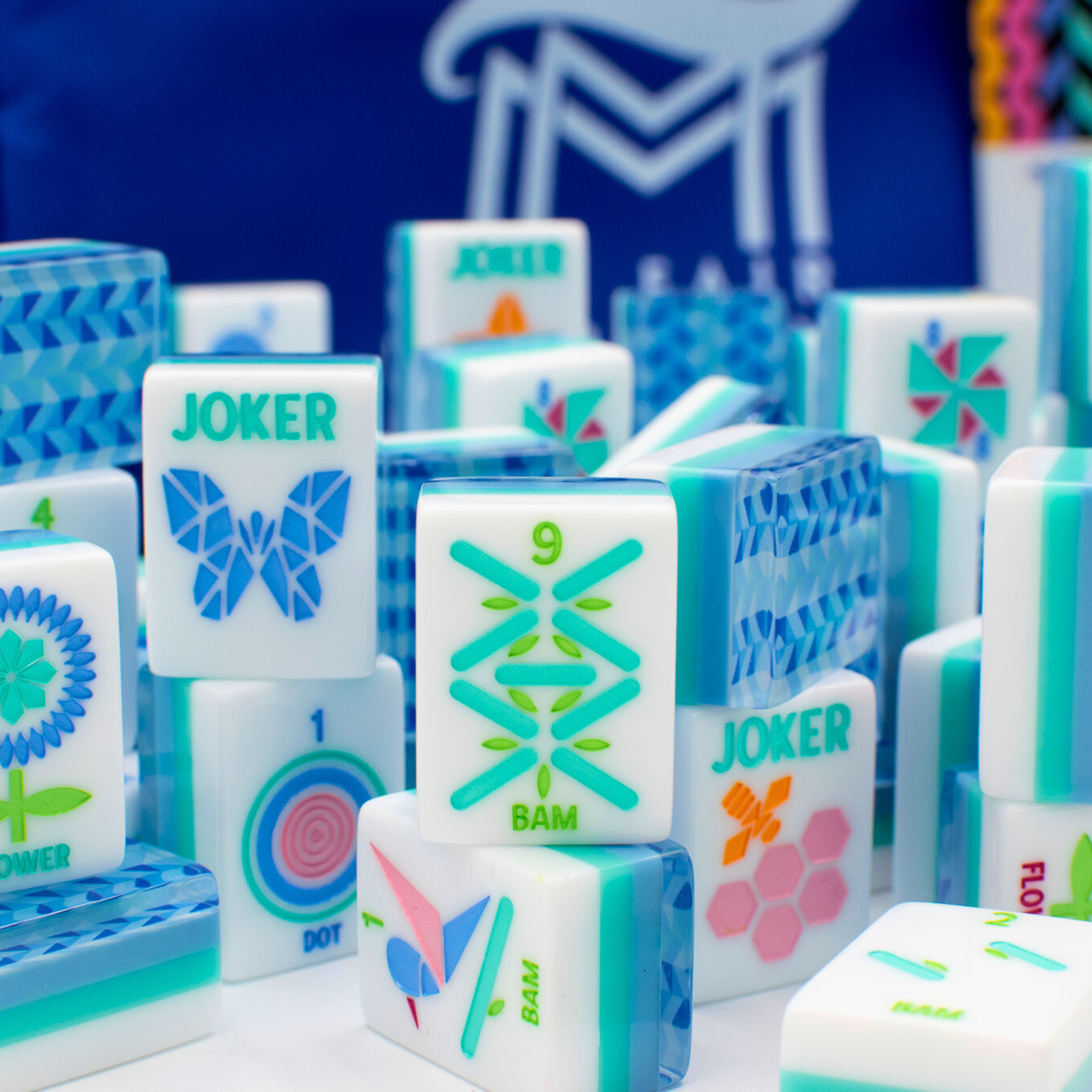 Colorful game tiles with various symbols and text on a blue background