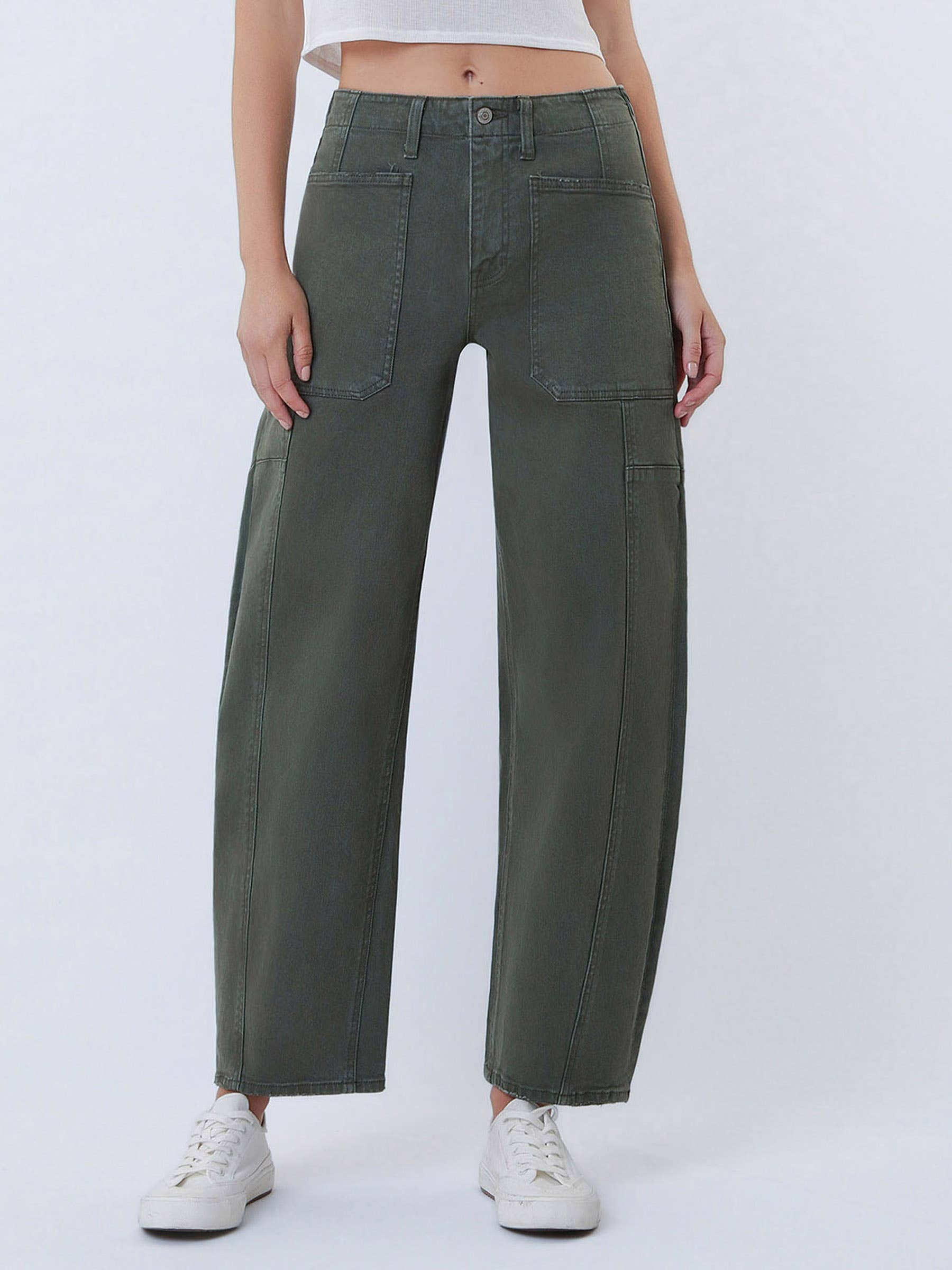 Person wearing olive green cargo pants on a white background
